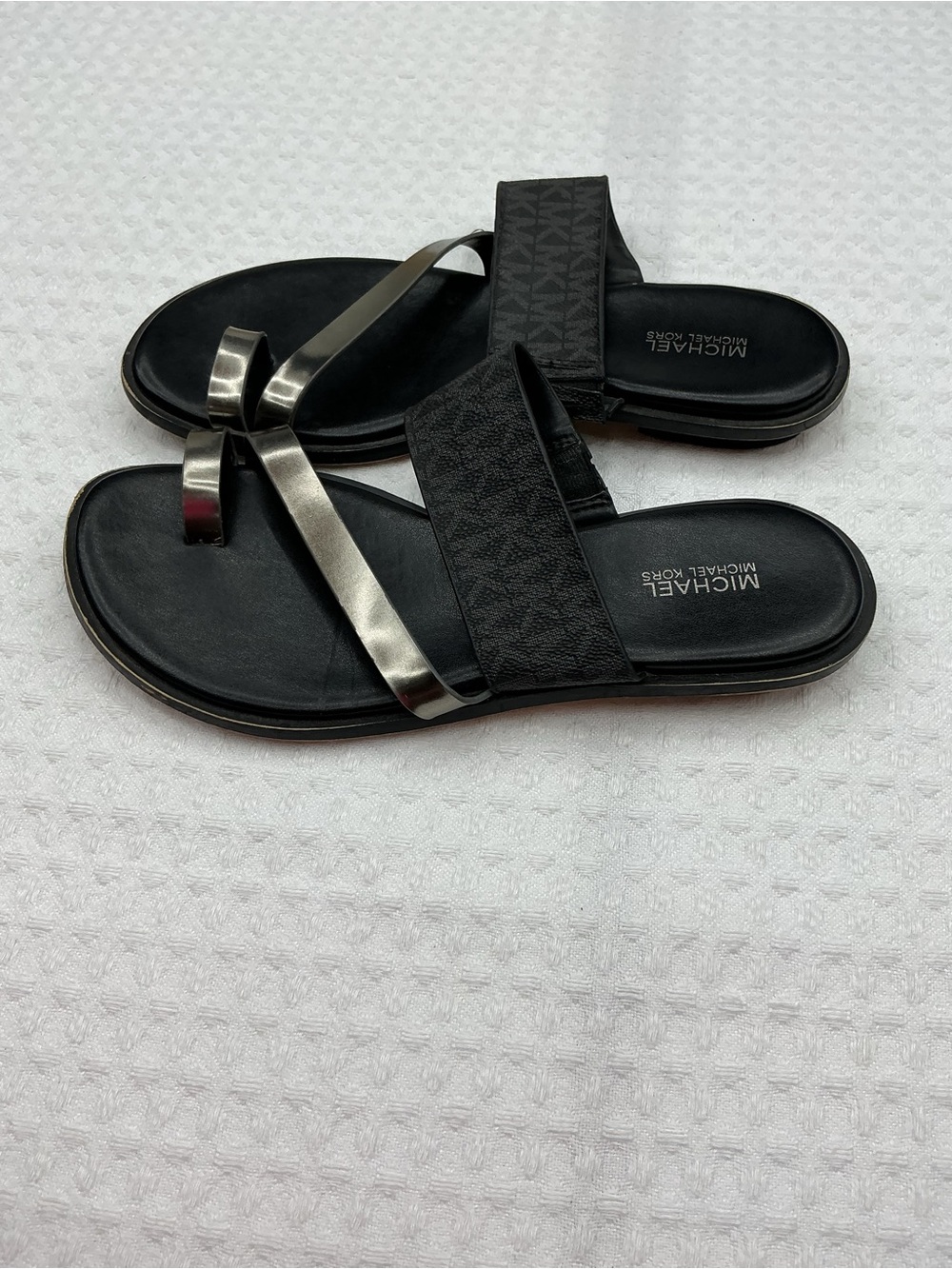 MICHAEL Michael Kors Black Slides with Metallic Silver Straps